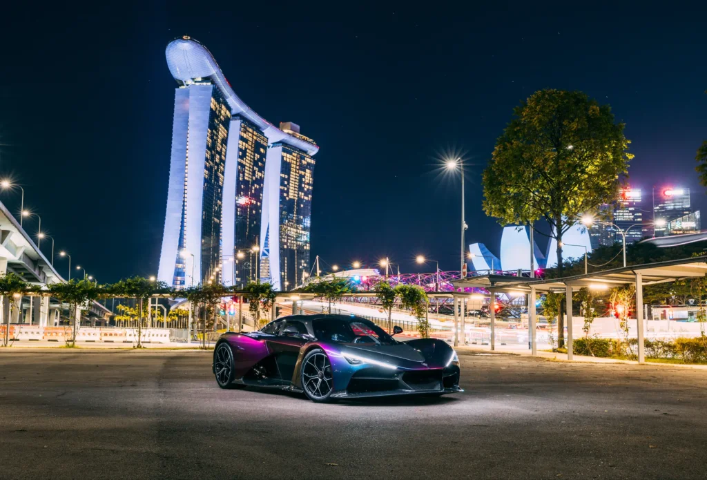 Zenvo Aurora on display in Singapore at night, with Marina Bay Sands behind